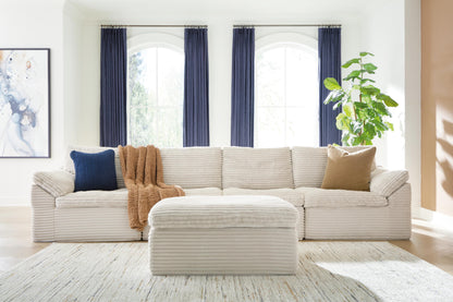 Orange Furniture Outlet - Ashley Furniture - Fannin Sectional - RAF 4-Piece Sectional with Ottoman / Ivory - PC84304S1