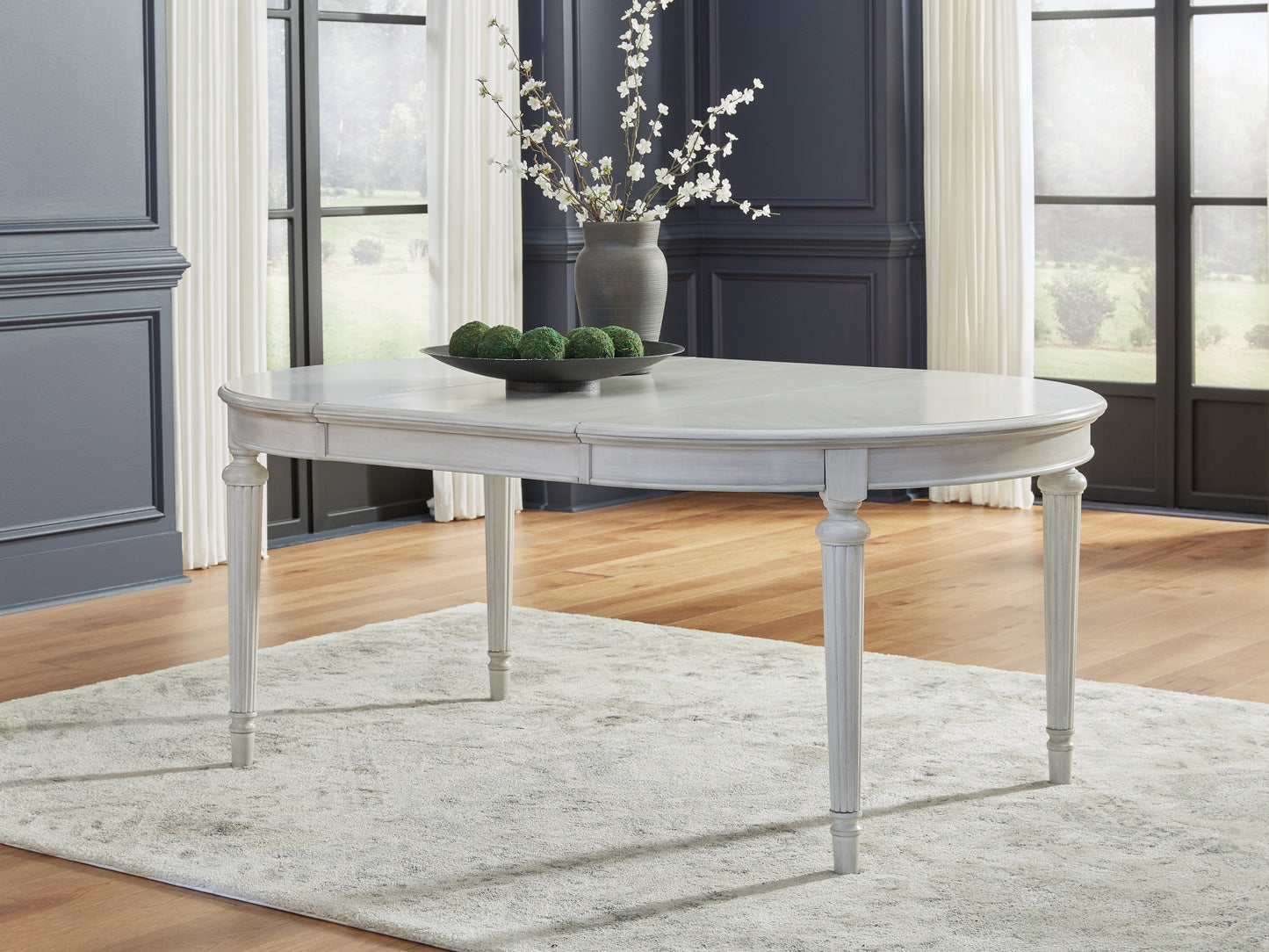 Orange Furniture Outlet - Ashley Furniture - Montelaine Dining Room - Oval Dining Room EXT Table / Antique White - D795-35