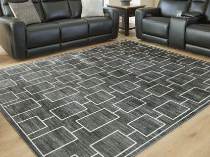 Orange Furniture Outlet - Ashley Furniture - Elderland Rug - Washable 7'6" x 9'6" Area Rug / Black/Gray - R407401