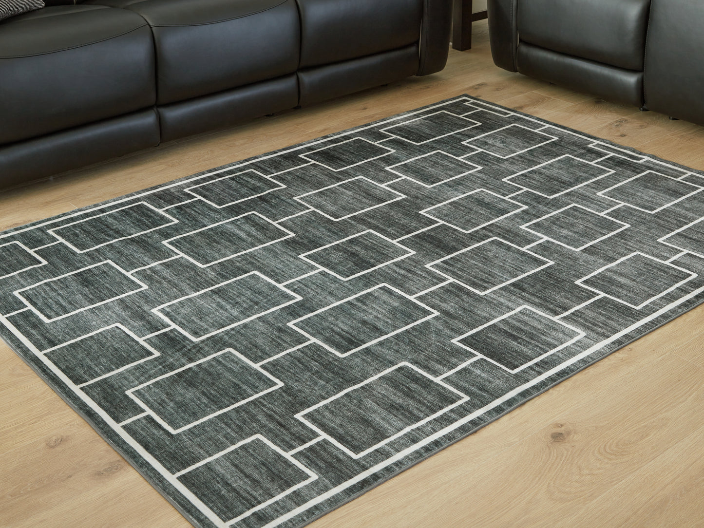 Orange Furniture Outlet - Ashley Furniture - Elderland Rug - Washable 7'6" x 9'6" Area Rug / Black/Gray - R407401