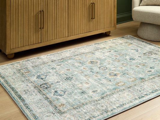 Orange Furniture Outlet - Ashley Furniture - Ladstoney Rug - 5' x 7' Area Rug / Teal/Beige/Ochre - R407502