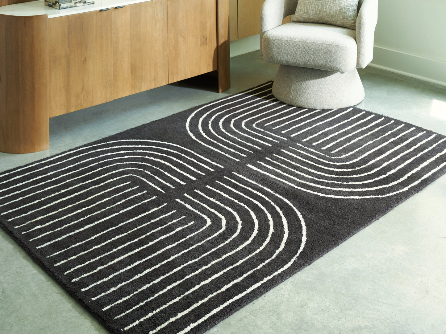 Orange Furniture Outlet - Ashley Furniture - Eldonmore Rug - 5' x 7' Area Rug / Black/Ivory - R407572